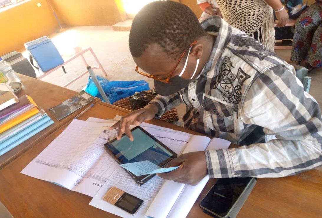 Photo of a person working on a tablet