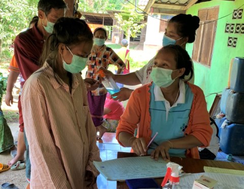 Women wearing masks and talking