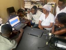 Health workers discussing data in a health facility in Ghana. 