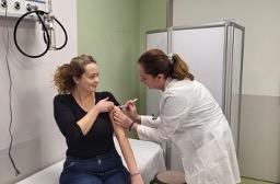 A doctor gives a patient an injection in Serbia. 